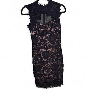 Betsy & Adam short black lace dress with tan slip underneath. Appx size XS/S